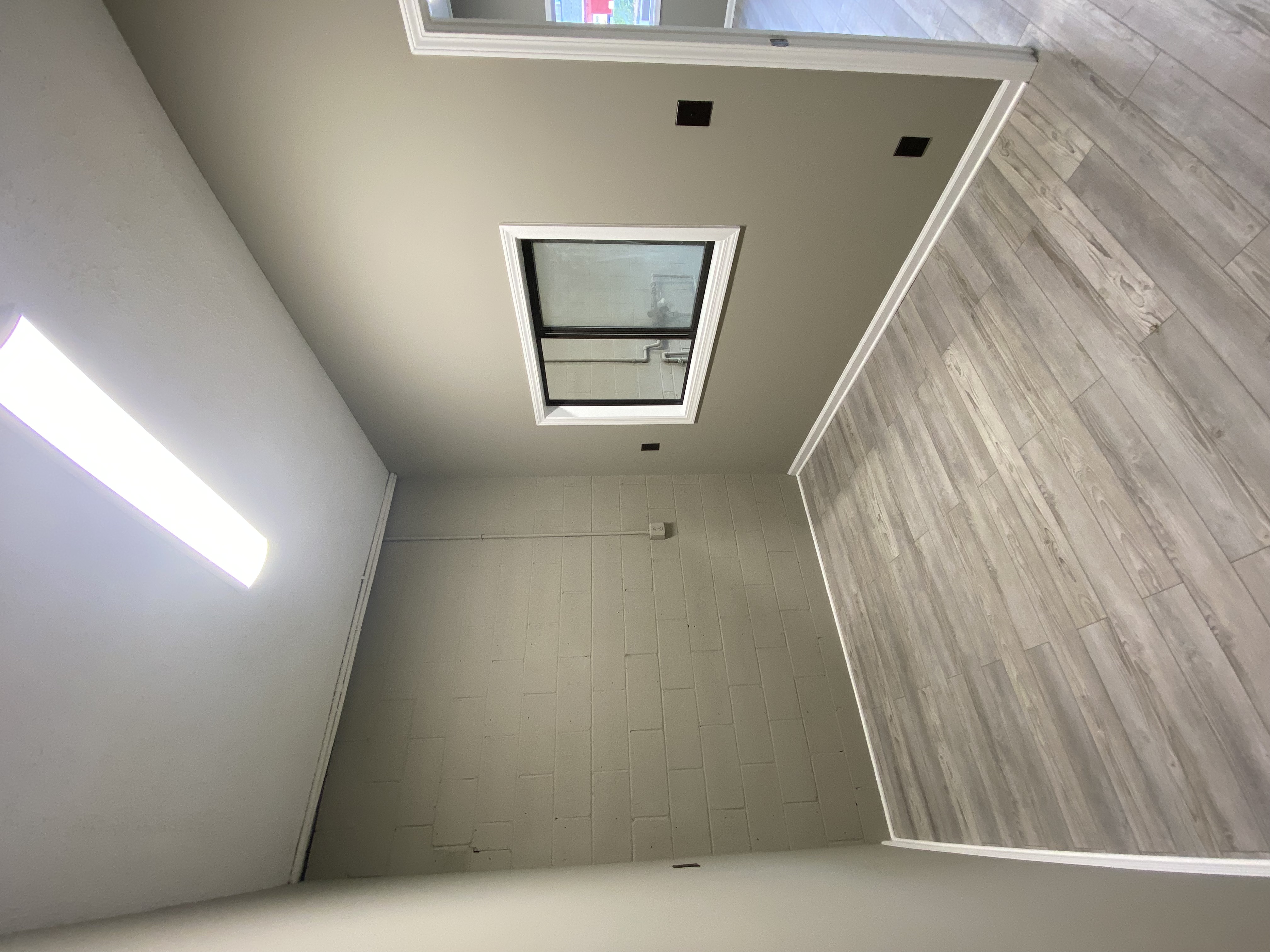 Renovated room with new door and flooring